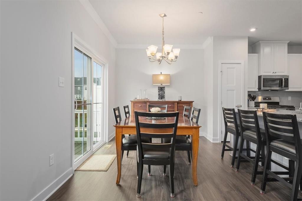 232 Cranesbill Drive Mars, PA 16046 - Photo 10 of 25 a view of a dining room with furniture and wooden floor
