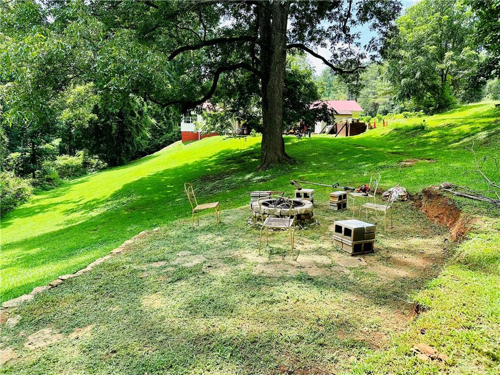 2582 White Sulphur Road Gainesville, GA 30501 - Photo 1 of 7 a view of an outdoor space with deck and tree