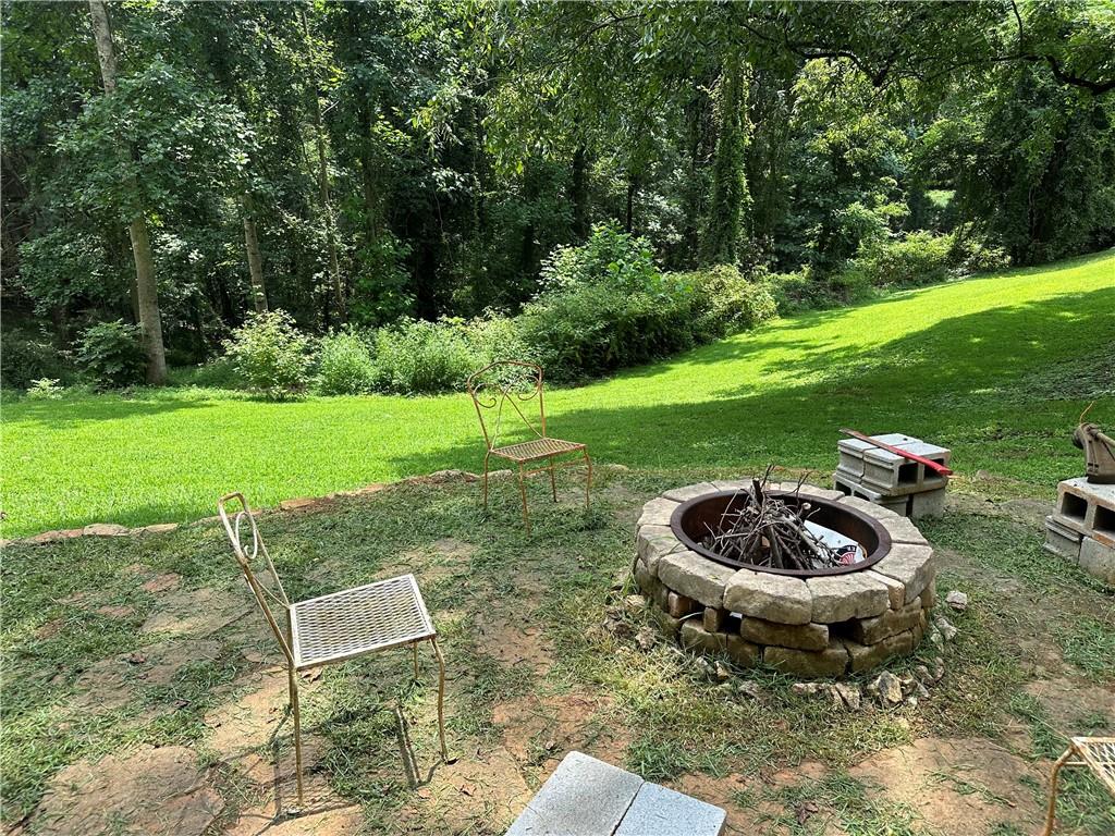 2582 White Sulphur Road Gainesville, GA 30501 - Photo 2 of 7 a table and chairs in backyard of the house