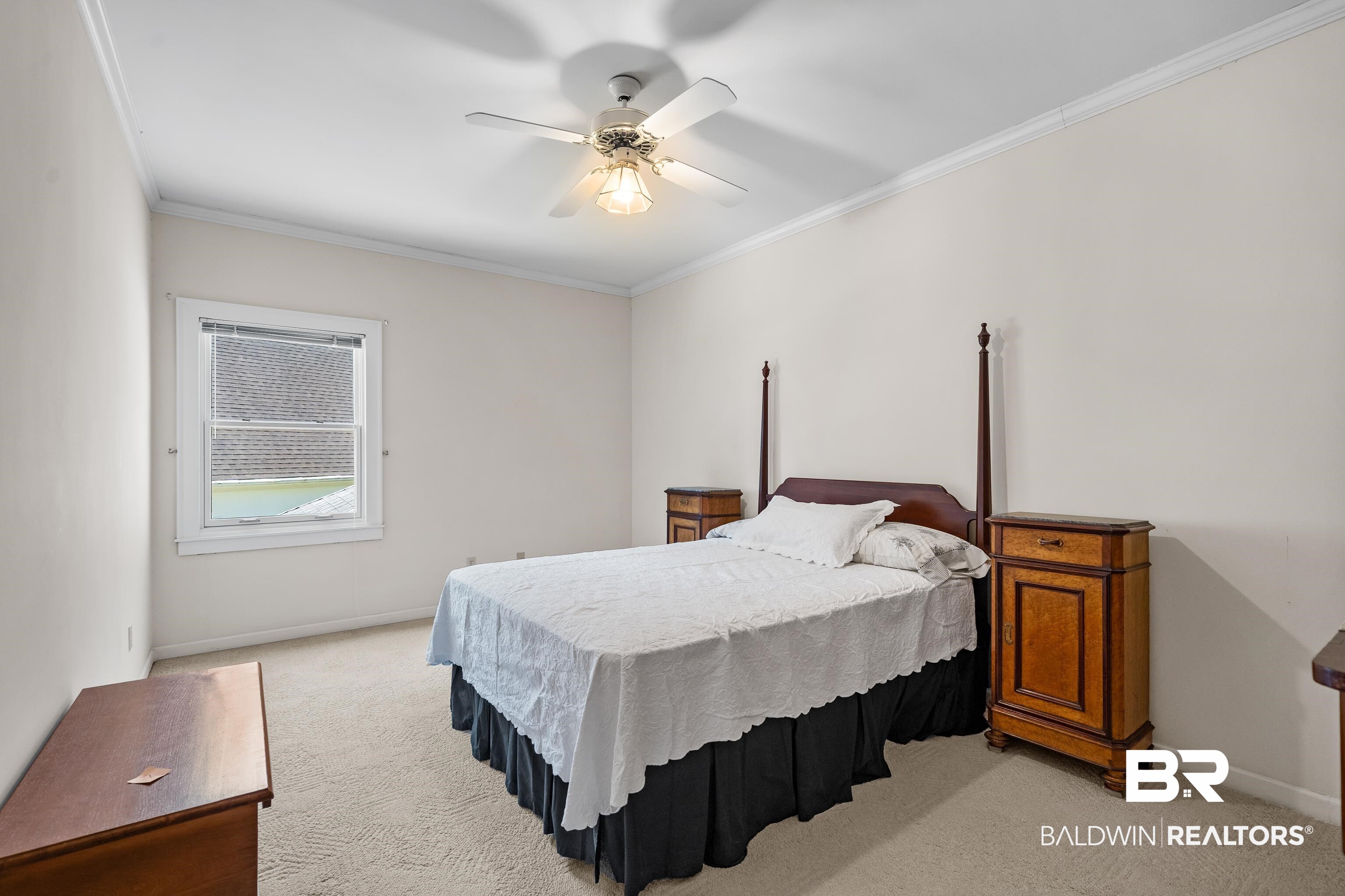 4272 Bit And Spur Road, Unit 12 Mobile, AL 36608 - Photo 27 of 34 Bedroom featuring light carpet, crown molding, baseboards, and a ceiling fan
