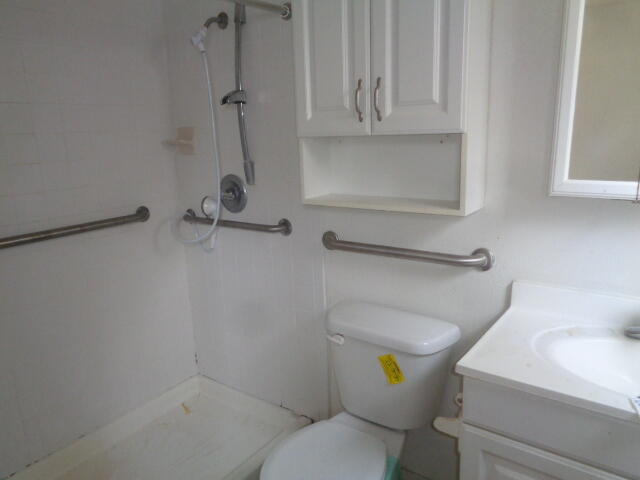 1329 49th Street Lubbock, TX 79412 - Photo 7 of 13 a bathroom with a toilet and a sink