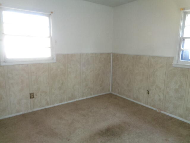 1329 49th Street Lubbock, TX 79412 - Photo 9 of 13 an empty room with a window