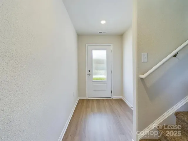 a view of wooden floor in an empty room