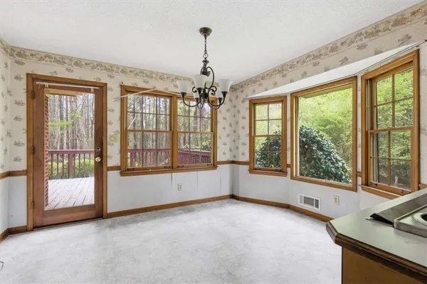 a very nice looking room with a large window and a bed