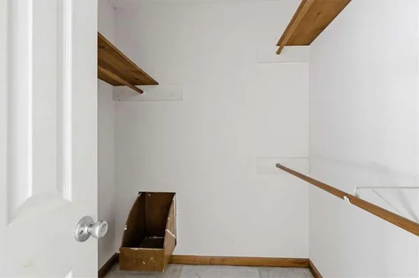 a view of staircase with white walls