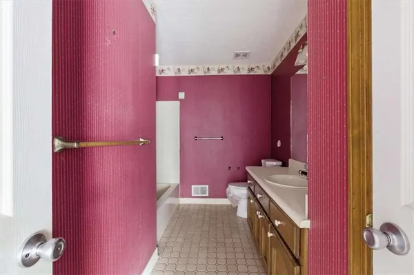 a bathroom with a sink a vanity and a mirror