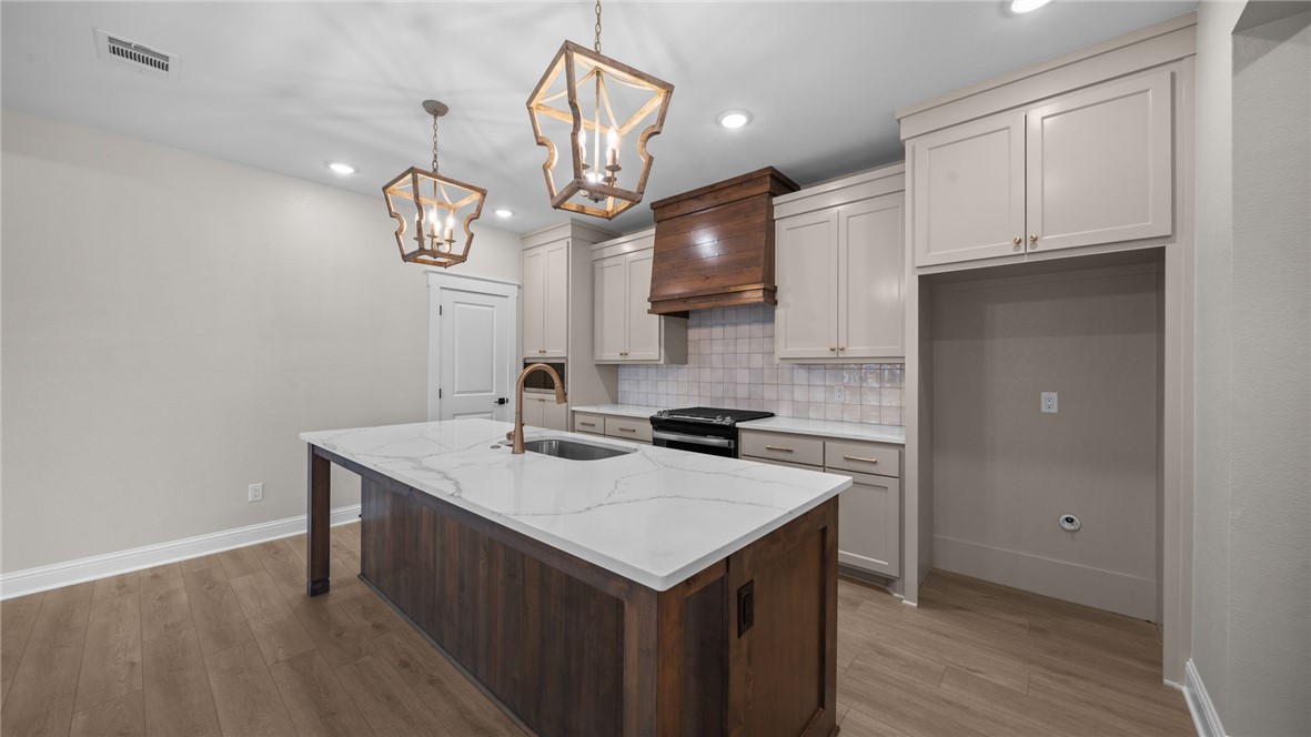 162 Buffalo Rdg Road Giddings, TX 78942 - Photo 4 of 31 a kitchen with a sink cabinets and wooden floor