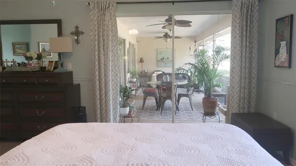 a view of a room with a dining table chairs and entryway