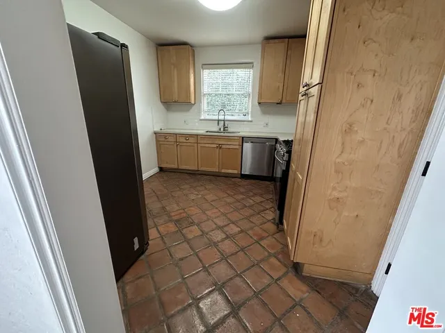 a bathroom with a sink a mirror and a shower