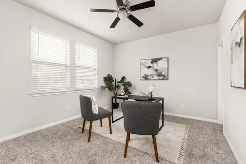 a living room with furniture and a window