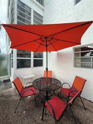 a backyard of a house with seating space