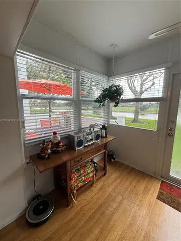 a room with gym equipment and a large window
