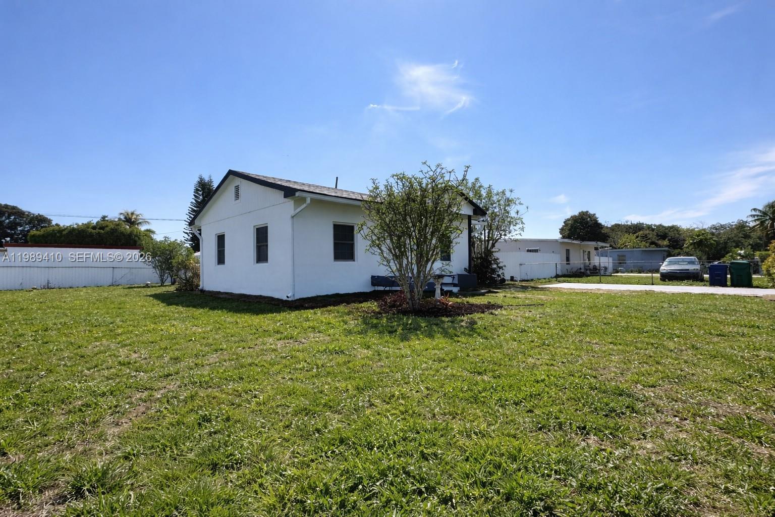 2450 Northwest 157th St Road Miami Gardens, FL 33054 - Photo 18 of 24 a view of a house with a yard