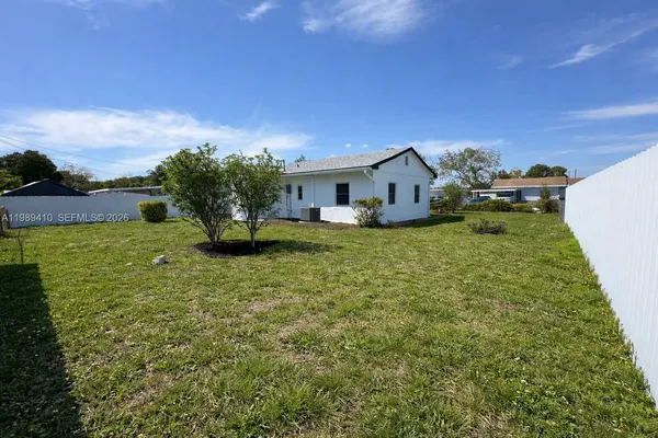 a house view with a garden space