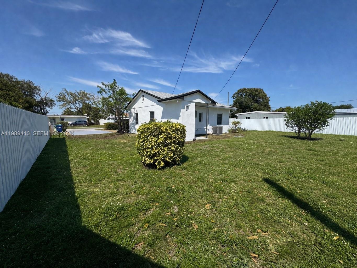 2450 Northwest 157th St Road Miami Gardens, FL 33054 - Photo 21 of 24 a house view with a garden space