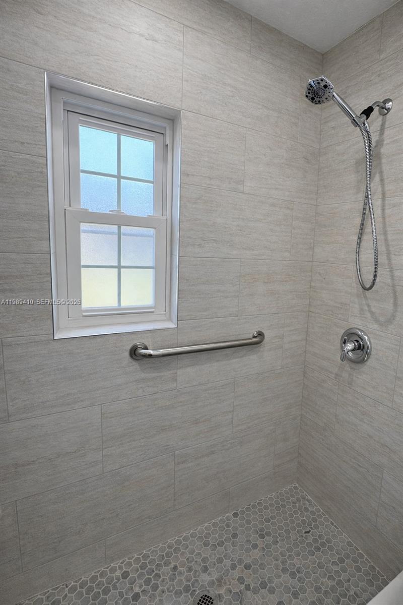 2450 Northwest 157th St Road Miami Gardens, FL 33054 - Photo 10 of 24 a bathroom with a window