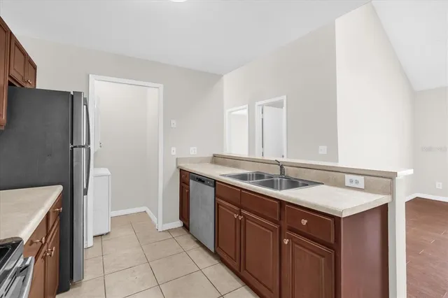 a kitchen that has a sink and a stove