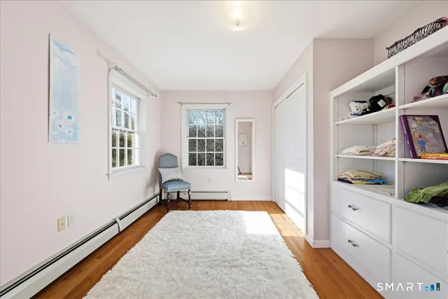 a spacious bedroom with a bed and a window