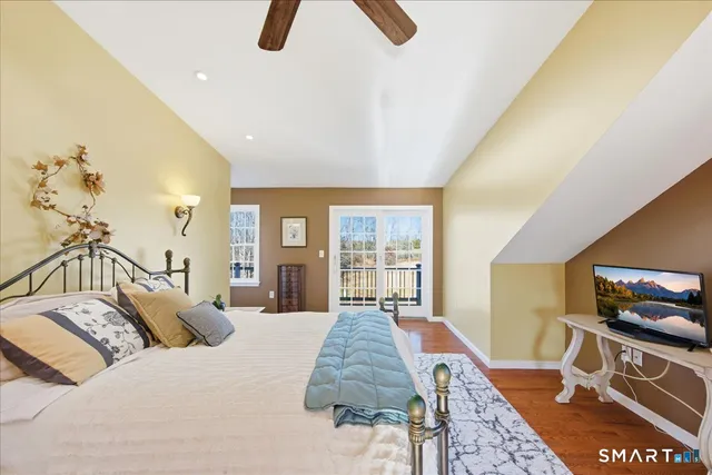 a bedroom with a bed and a couch