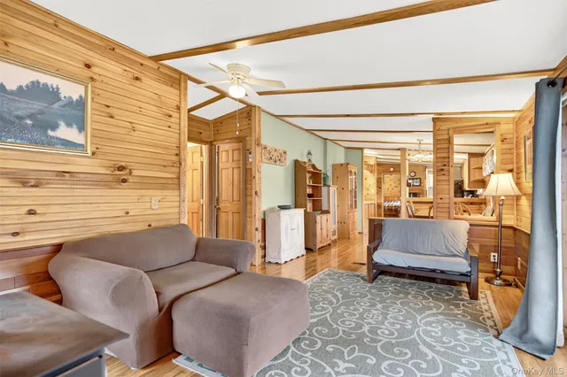 a living room with furniture and a rug