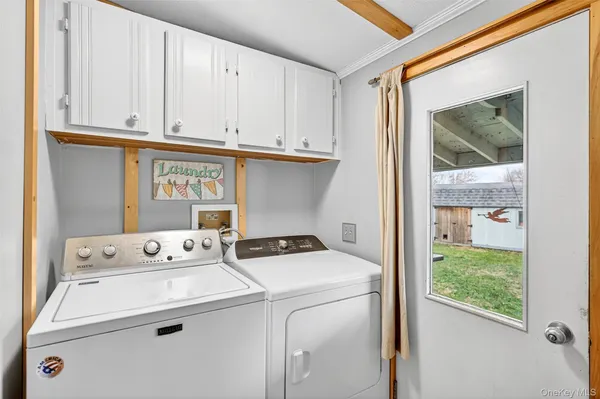 a utility room with dryer and washer