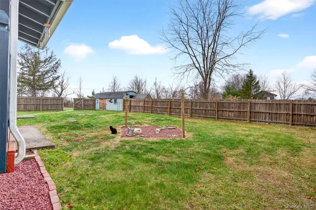 a view of a park with iron fence