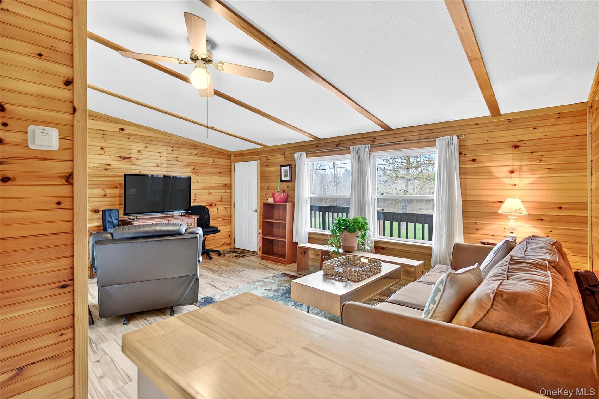 448 Sand Hill Road Gardiner, NY 12525 - Photo 3 of 29 a living room with furniture and a flat screen tv