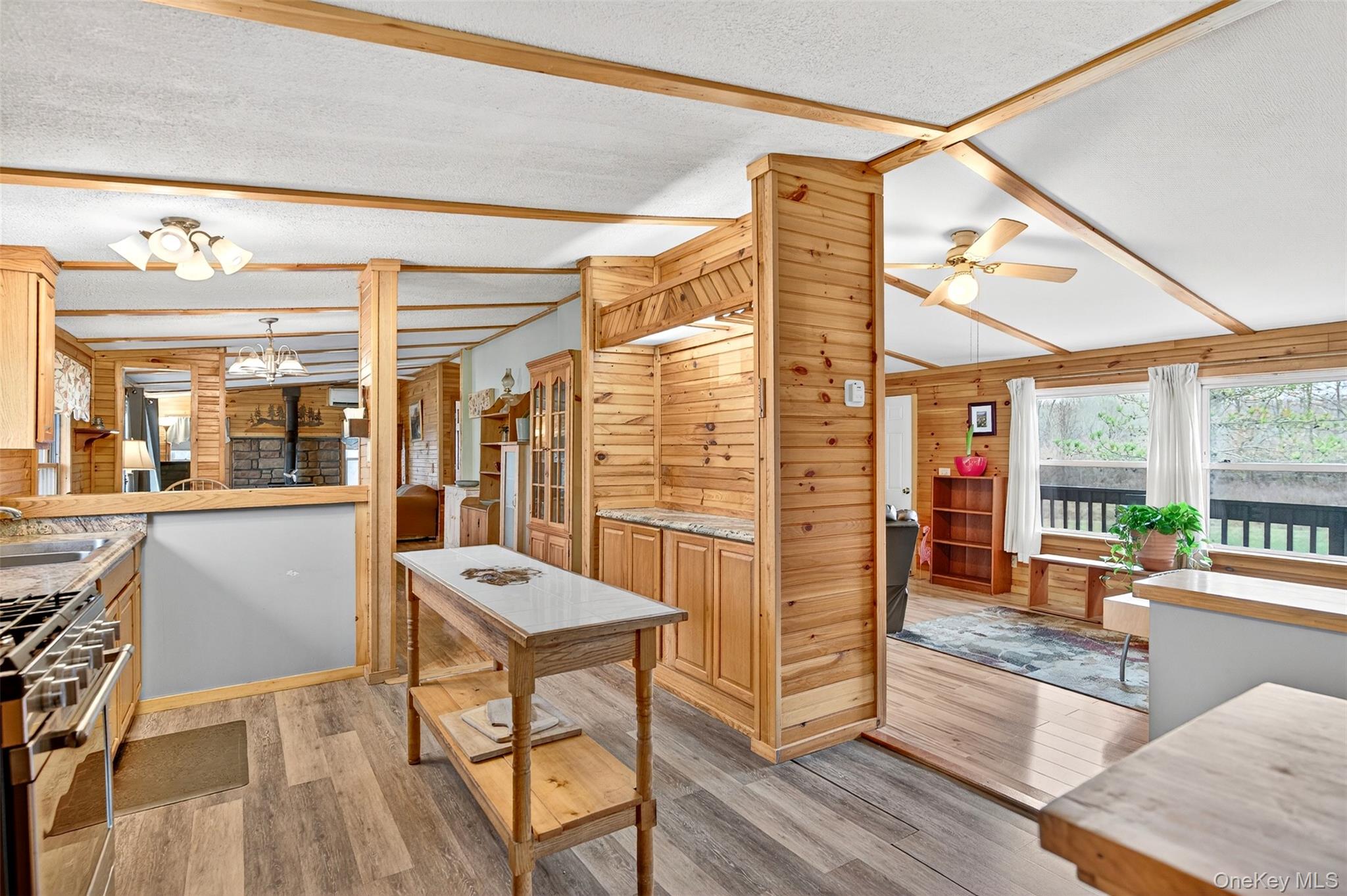 448 Sand Hill Road Gardiner, NY 12525 - Photo 5 of 29 a view of a dining room with furniture large windows and wooden floor