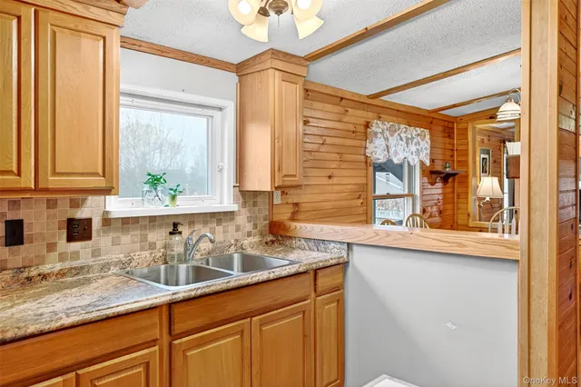 a kitchen with a sink and a window