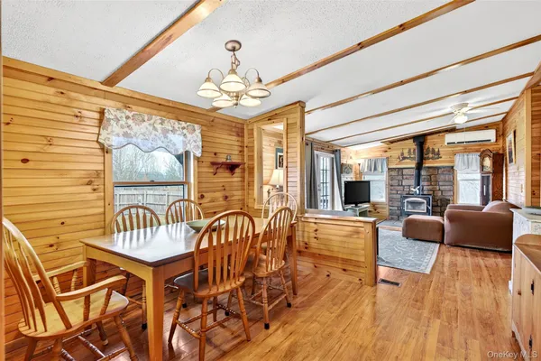 a view of a livingroom with furniture window and wooden floor