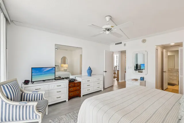 a bedroom with furniture and windows