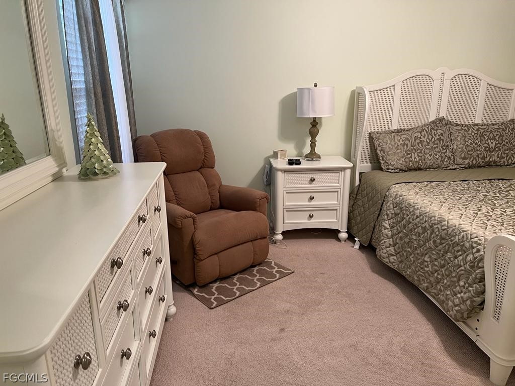 3013 Futuna Lane Naples, FL 34119 - Photo 12 of 21 a bedroom with furniture and a baby crib