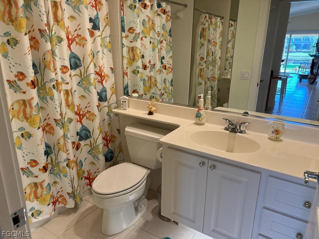 3013 Futuna Lane Naples, FL 34119 - Photo 16 of 21 a bathroom with a sink and a toilet