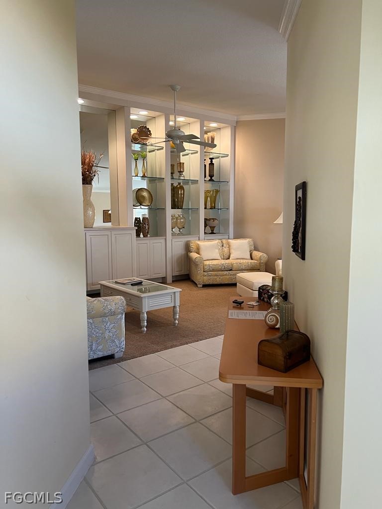 3013 Futuna Lane Naples, FL 34119 - Photo 21 of 21 a living room with furniture and a potted plant