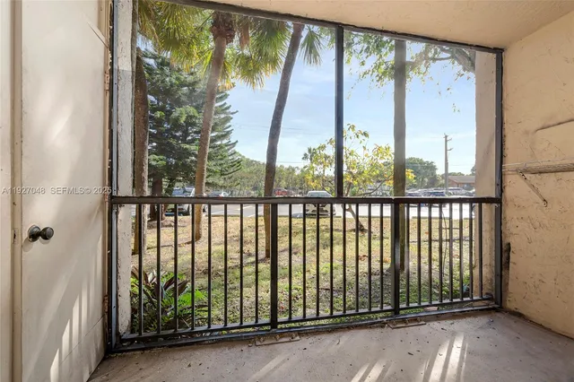 a view of a street view from a balcony