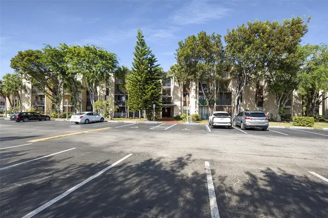 a view of road with parked cars