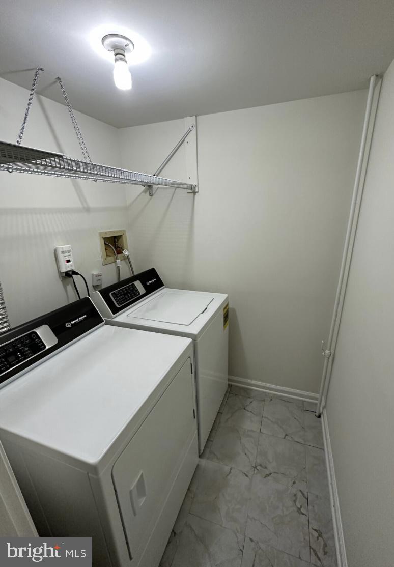 1002 Valley Glen Road, Unit 239 Elkins Park, PA 19027 - Photo 12 of 23 a utility room with dryer and washer