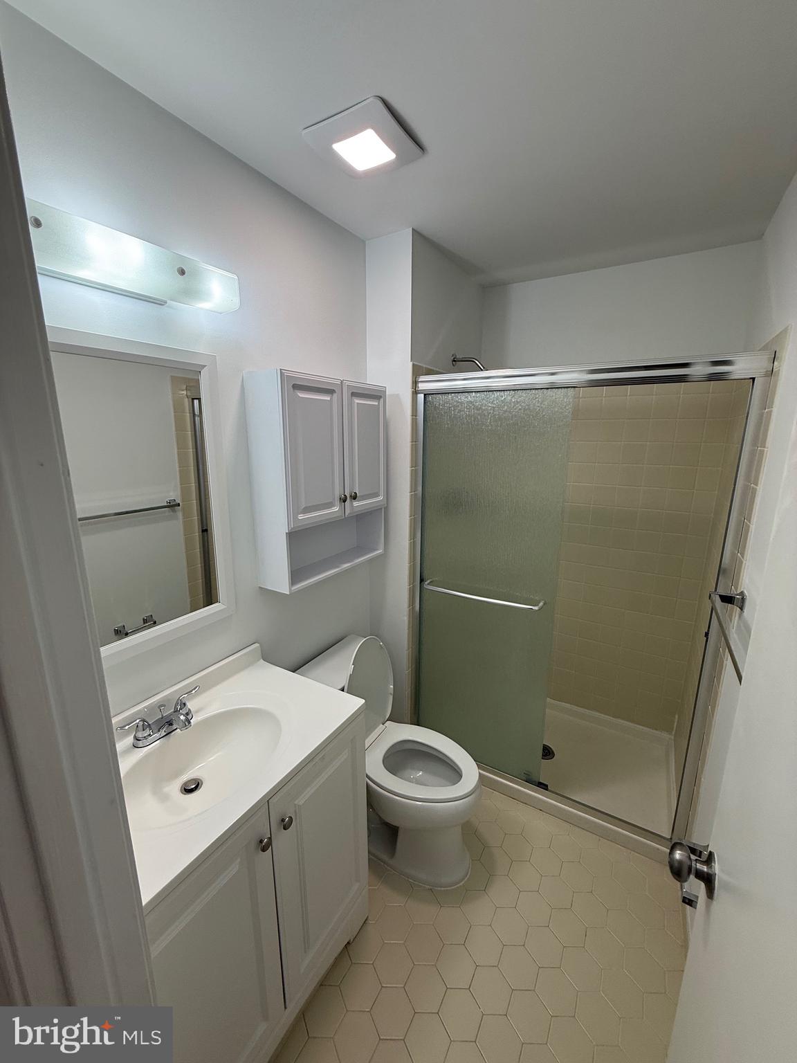 1002 Valley Glen Road, Unit 239 Elkins Park, PA 19027 - Photo 20 of 23 a bathroom with a sink a toilet and shower