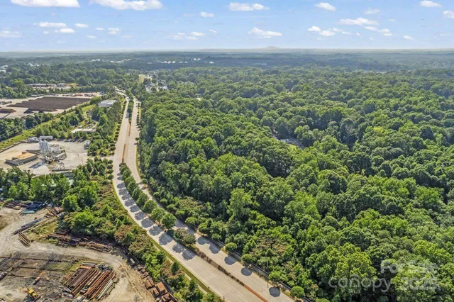 a view of a green field with an ocean view