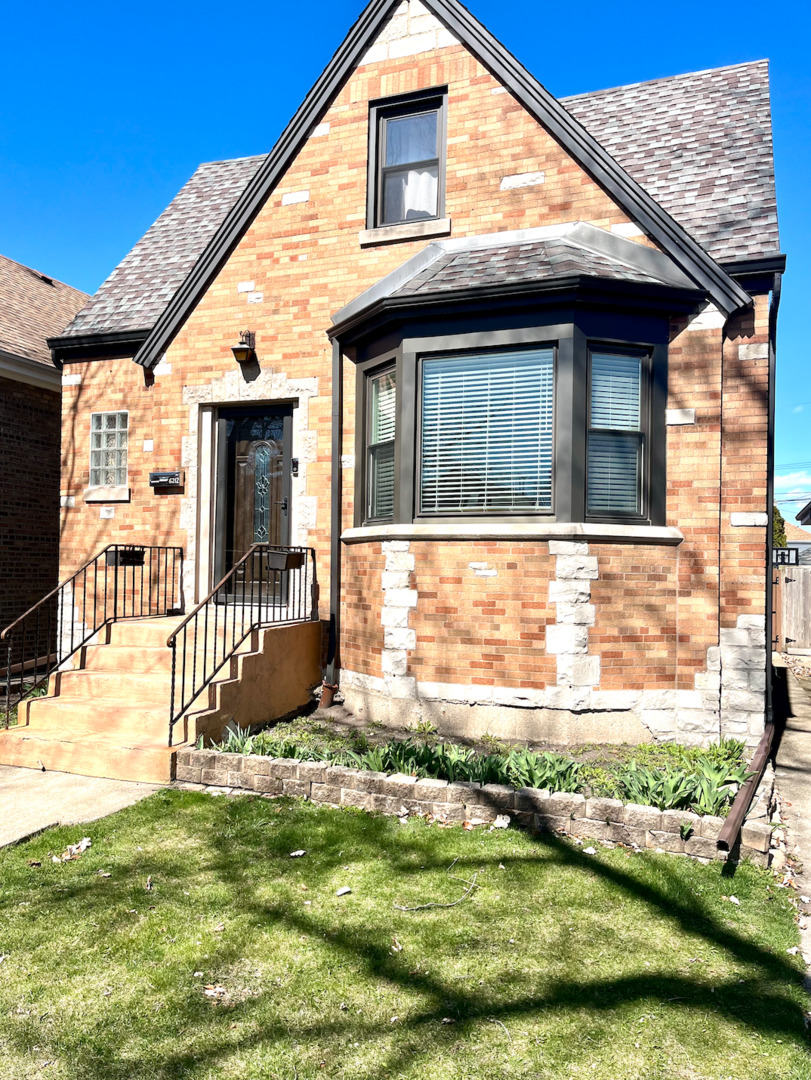 6212 West School Street Chicago, IL 60634 - Photo 1 of 11 a view of house with backyard