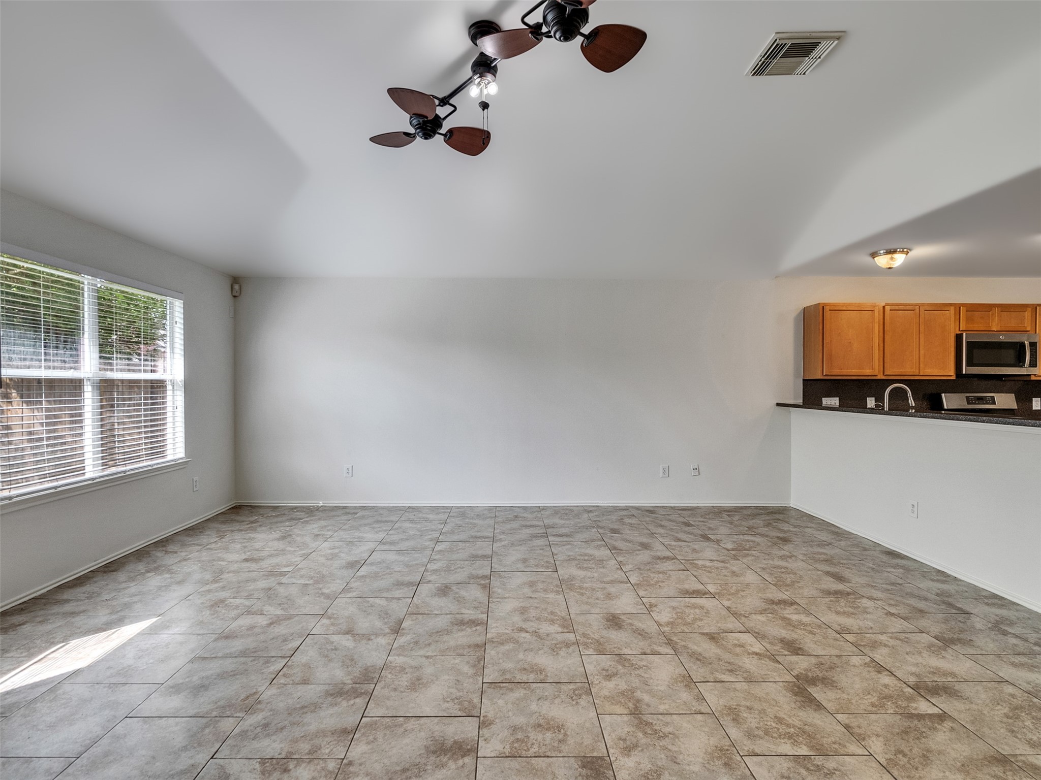 13431 Rural Oak Street Houston, TX 77034 - Photo 8 of 24 an empty room with a empty space and windows
