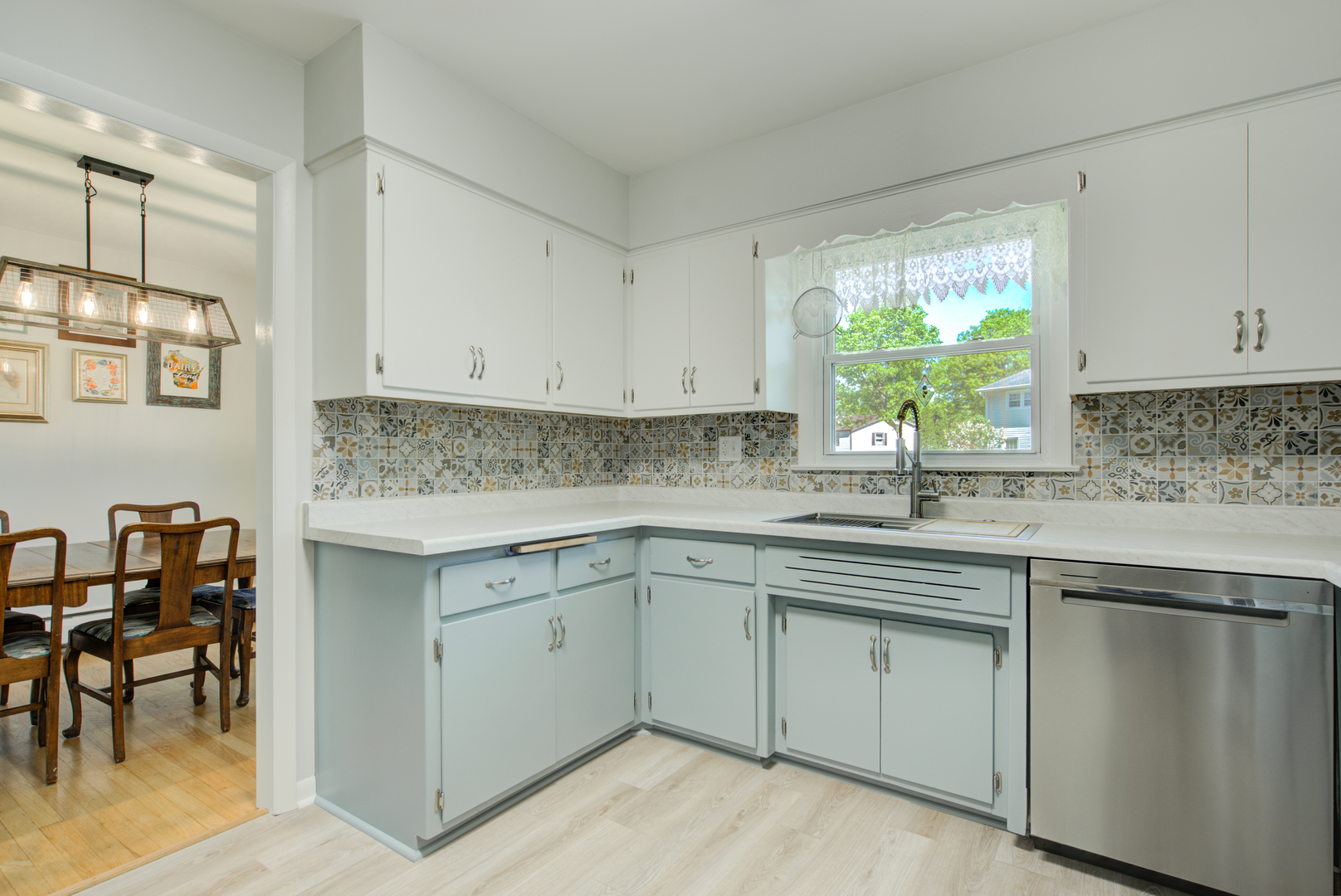 272 Scott Street Wheeling, IL 60090 - Photo 6 of 28 a kitchen with cabinets appliances a sink and a window