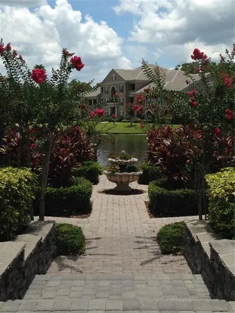 a view of a fountain in front of a house