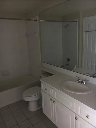 a bathroom with a sink a toilet and vanity