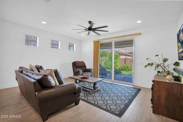 a living room with furniture and a window