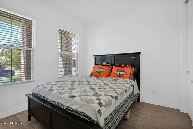 a bedroom with a bed and window