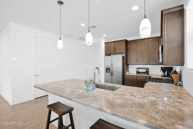 a kitchen with sink cabinets and outdoor space