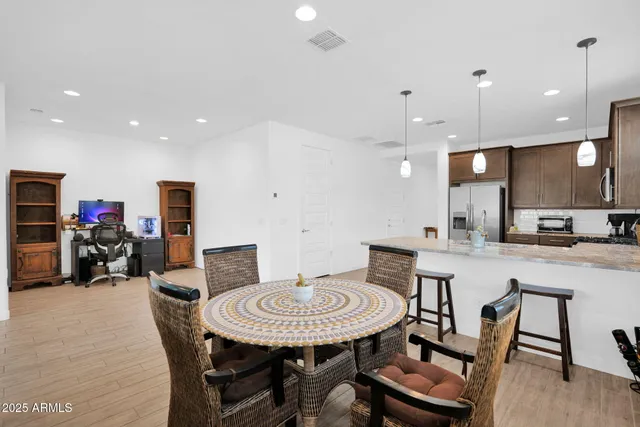 a view of a dining room with furniture and a wooden floor