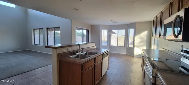 a kitchen with sink and window