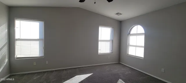 a view of empty room with windows